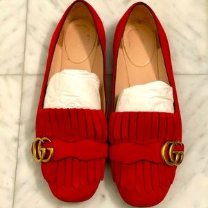 Gucci red suede flat shoes.